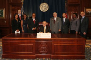 Representative Atwood and Governor Deal at the bill signing ceremony.