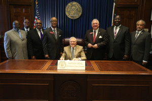 Rep. Atwood with Gov. Deal at the HB 736 bill signing ceremony. 